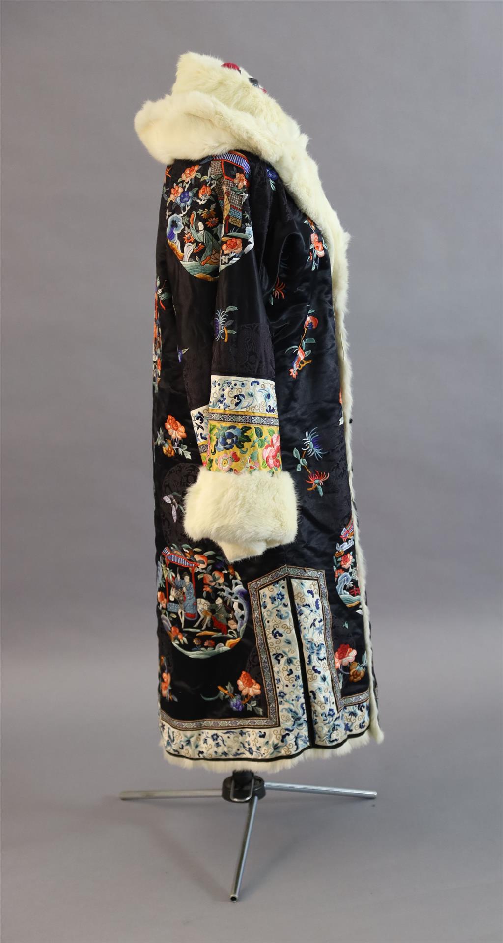 A Chinese silk embroidered winter robe, late 19th century/early 20th century, length 125cm